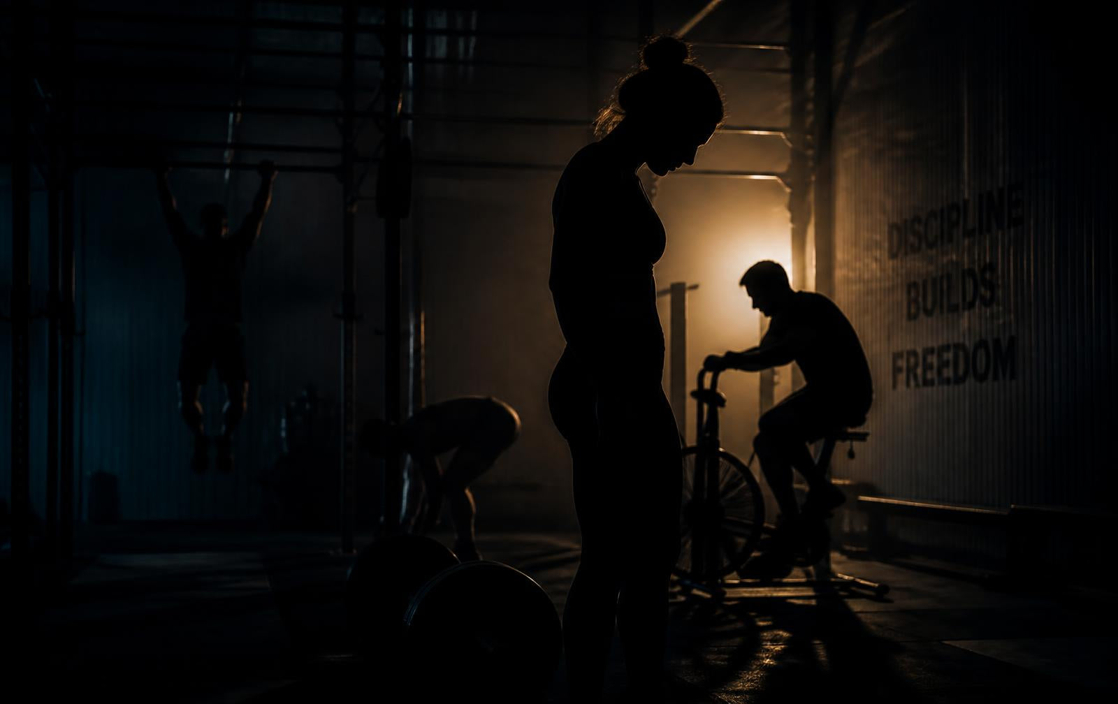 Athletes training in a dark gym